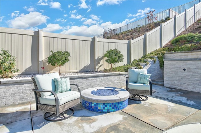 view of patio featuring a fire pit