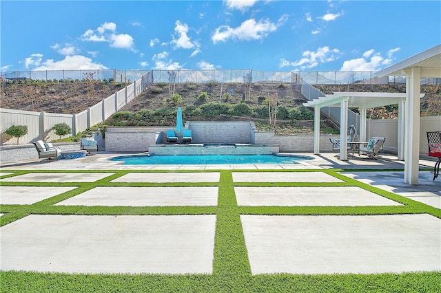 view of swimming pool featuring a mountain view and a patio