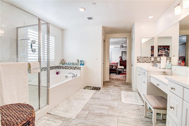 bathroom with vanity, ceiling fan, and independent shower and bath