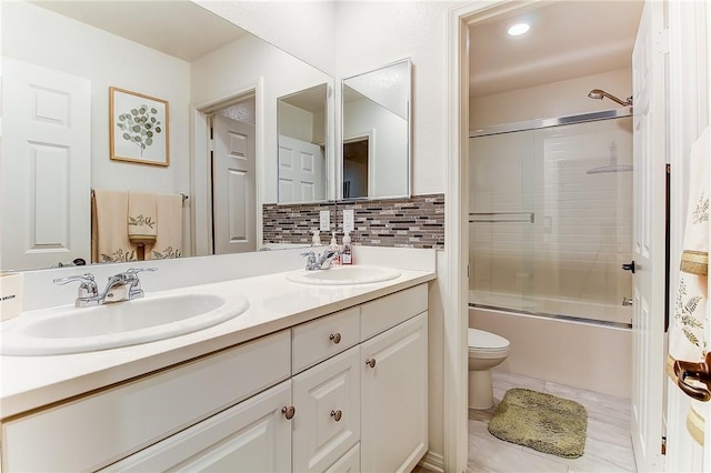 full bathroom with vanity, toilet, enclosed tub / shower combo, and tasteful backsplash