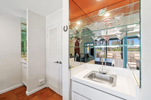 bathroom with tile patterned flooring and vanity