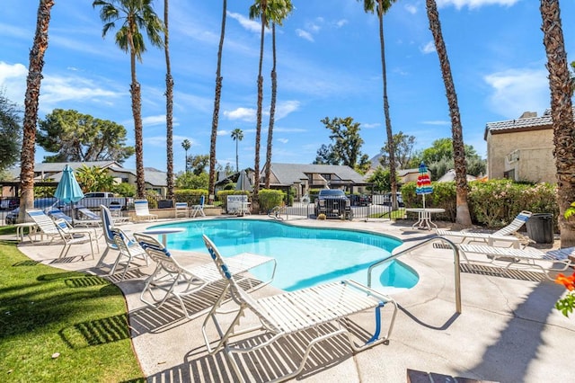 view of swimming pool with a patio