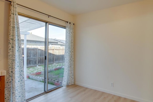 entryway with plenty of natural light and light hardwood / wood-style flooring