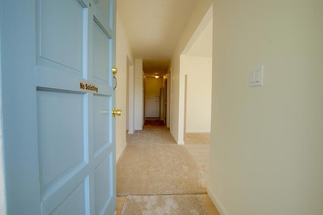 hallway with light carpet