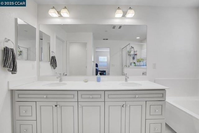 bathroom with shower with separate bathtub and vanity