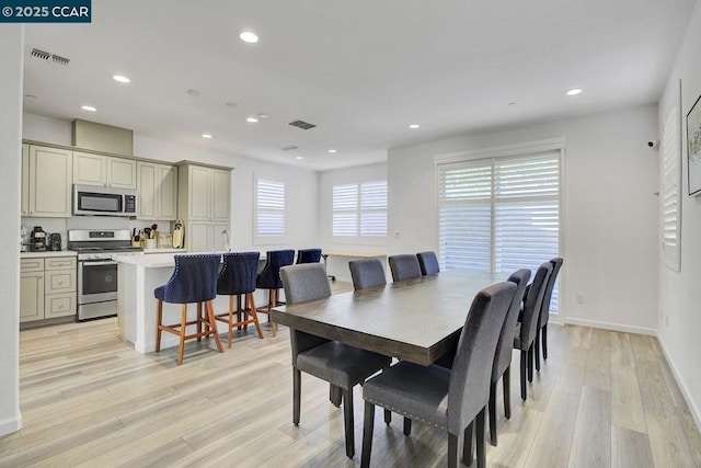 dining area with light wood-type flooring