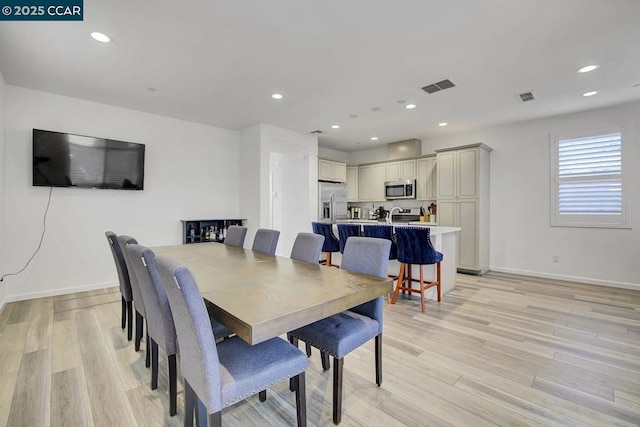 dining room featuring light hardwood / wood-style floors