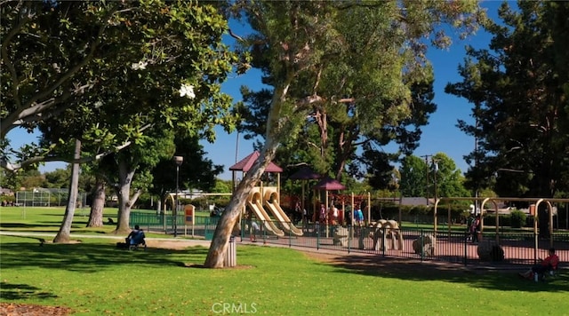 view of playground with a yard