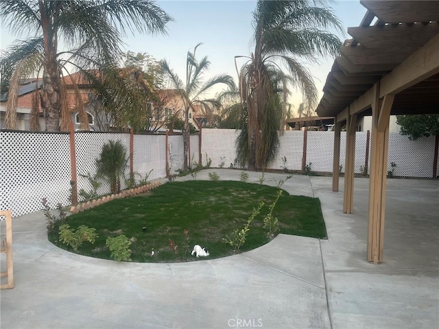 yard at dusk with a patio