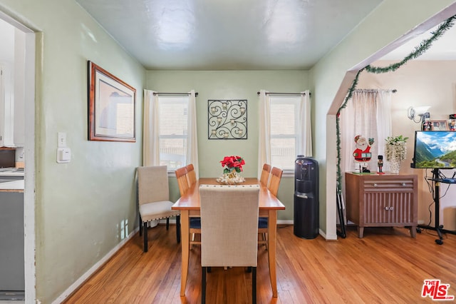 dining area featuring light wood-type flooring