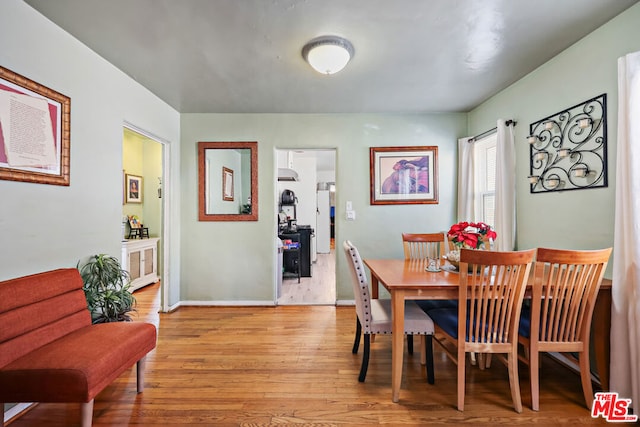 dining area with light hardwood / wood-style flooring