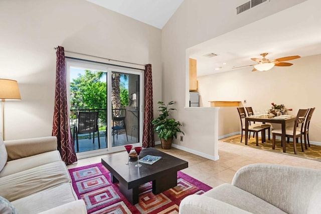 living room with light tile patterned floors, high vaulted ceiling, and ceiling fan