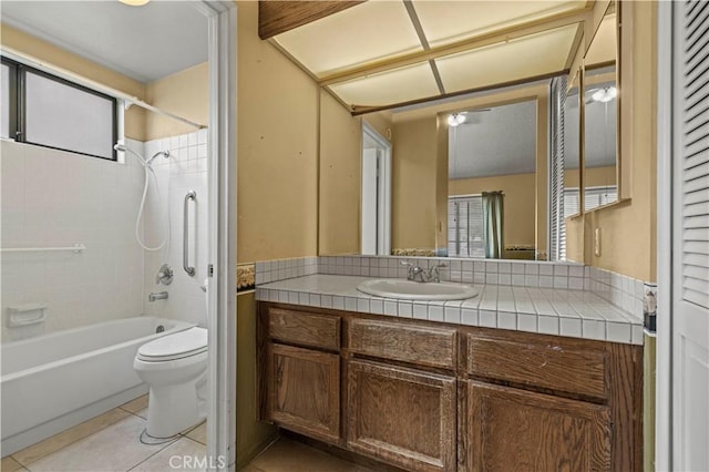 full bathroom featuring shower / washtub combination, tile patterned flooring, vanity, and toilet