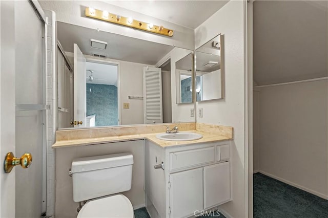 bathroom featuring vanity, toilet, and ceiling fan