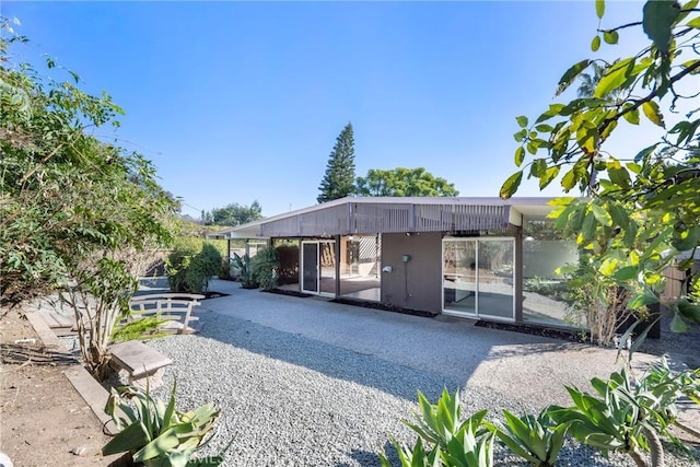 back of property featuring a patio