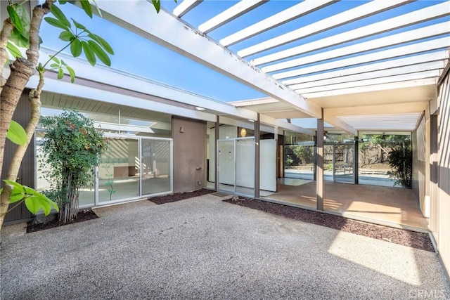 view of patio featuring a pergola