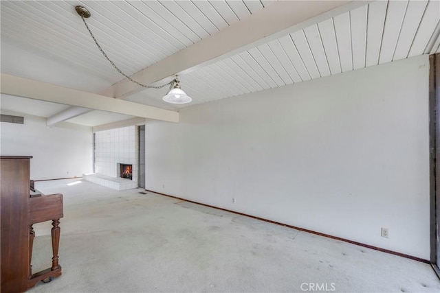 basement featuring carpet floors and a fireplace