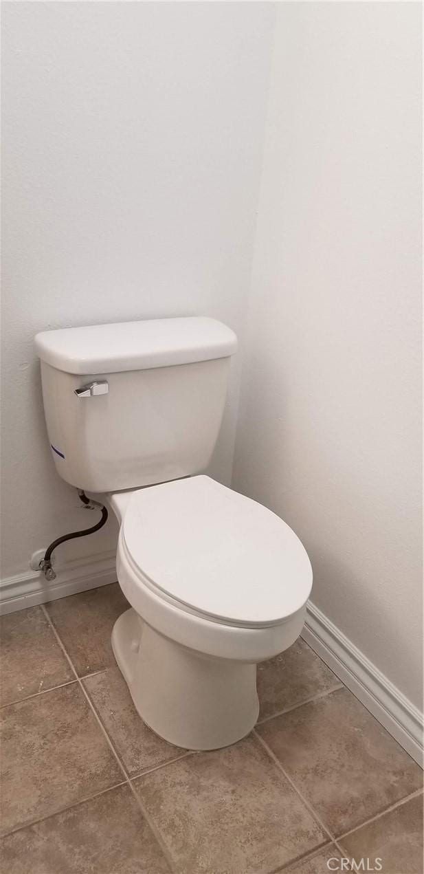 bathroom with tile patterned floors and toilet