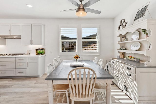 dining space featuring ceiling fan and light hardwood / wood-style flooring