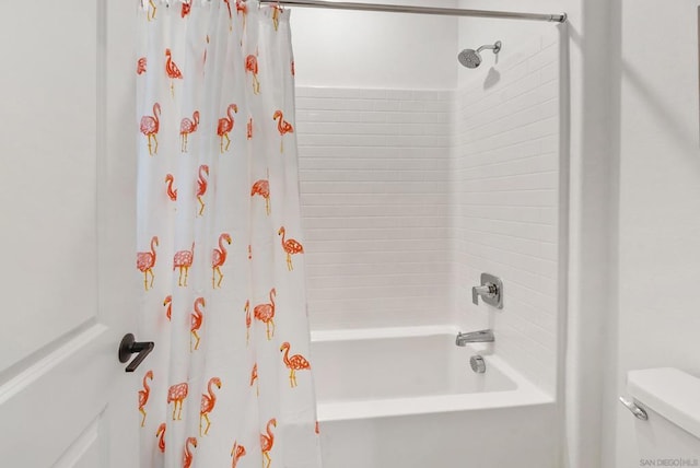 bathroom with shower / bath combo with shower curtain