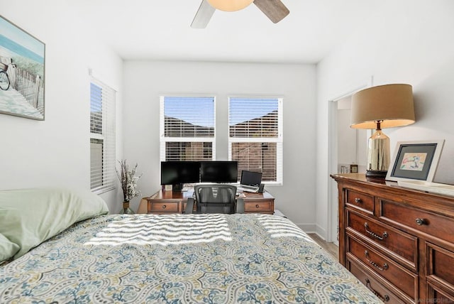 bedroom with hardwood / wood-style flooring and ceiling fan