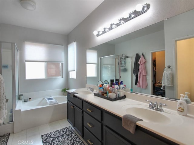 bathroom featuring tile patterned flooring, vanity, and independent shower and bath