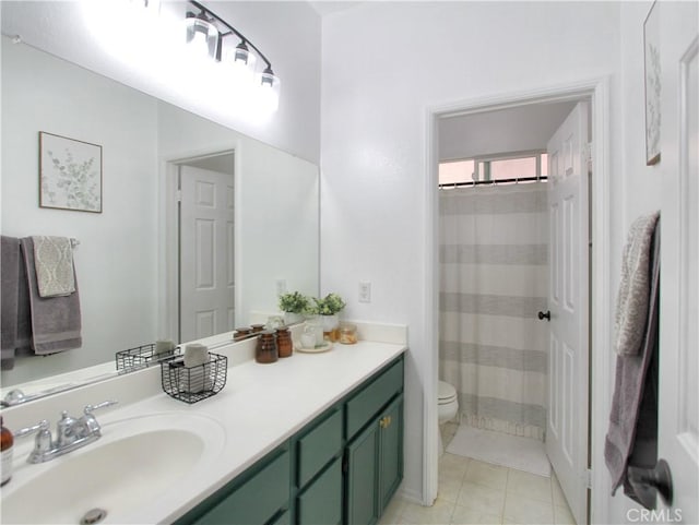 bathroom with tile patterned flooring, vanity, toilet, and curtained shower