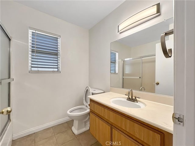 full bathroom featuring tile patterned flooring, vanity, toilet, and shower / bath combination with glass door