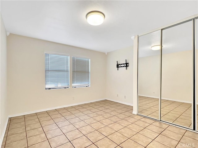 empty room with light tile patterned flooring