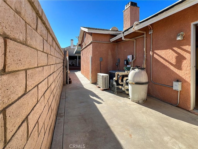 view of home's exterior featuring a patio area and central AC