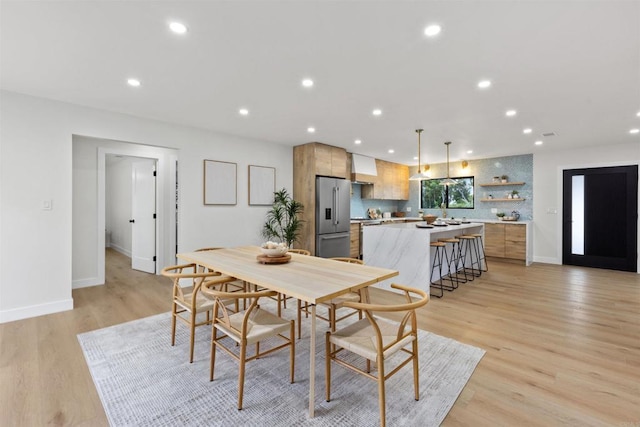 dining room featuring light hardwood / wood-style flooring