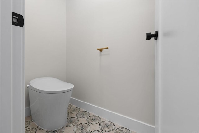 bathroom featuring toilet and tile patterned floors