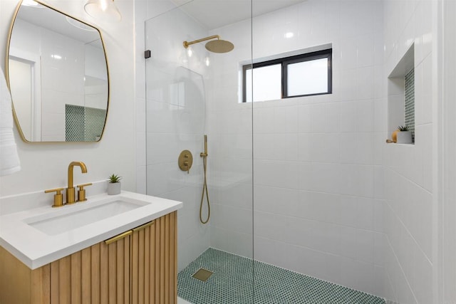 bathroom featuring vanity and a tile shower