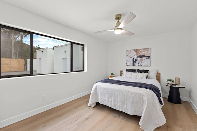 bedroom featuring ceiling fan and light hardwood / wood-style floors