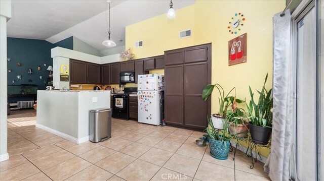 kitchen with hanging light fixtures, light tile patterned floors, dark brown cabinets, and black appliances