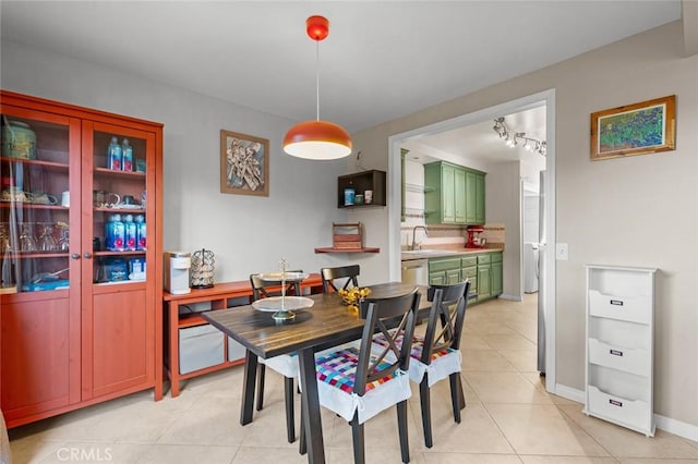 dining room with light tile patterned floors and sink