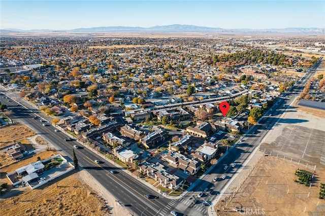 birds eye view of property featuring a mountain view