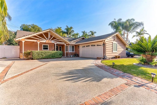 view of front of property with a front lawn and a garage