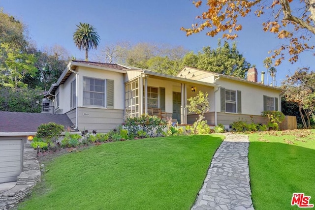 ranch-style house with a front lawn