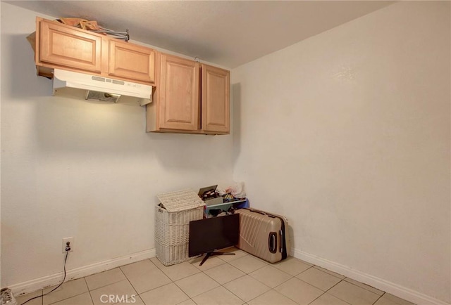 interior space featuring light brown cabinetry and light tile patterned floors