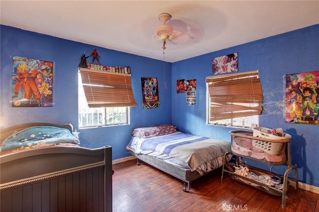 bedroom featuring hardwood / wood-style floors and ceiling fan