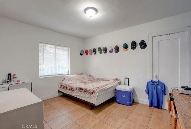 bedroom featuring light tile patterned floors