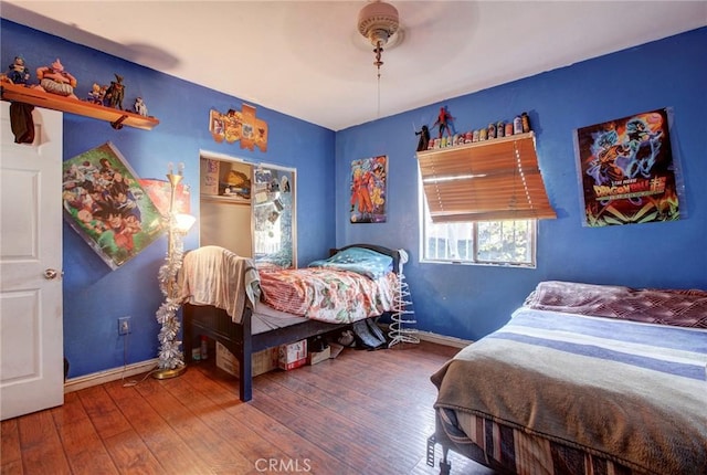 bedroom featuring hardwood / wood-style floors and ceiling fan