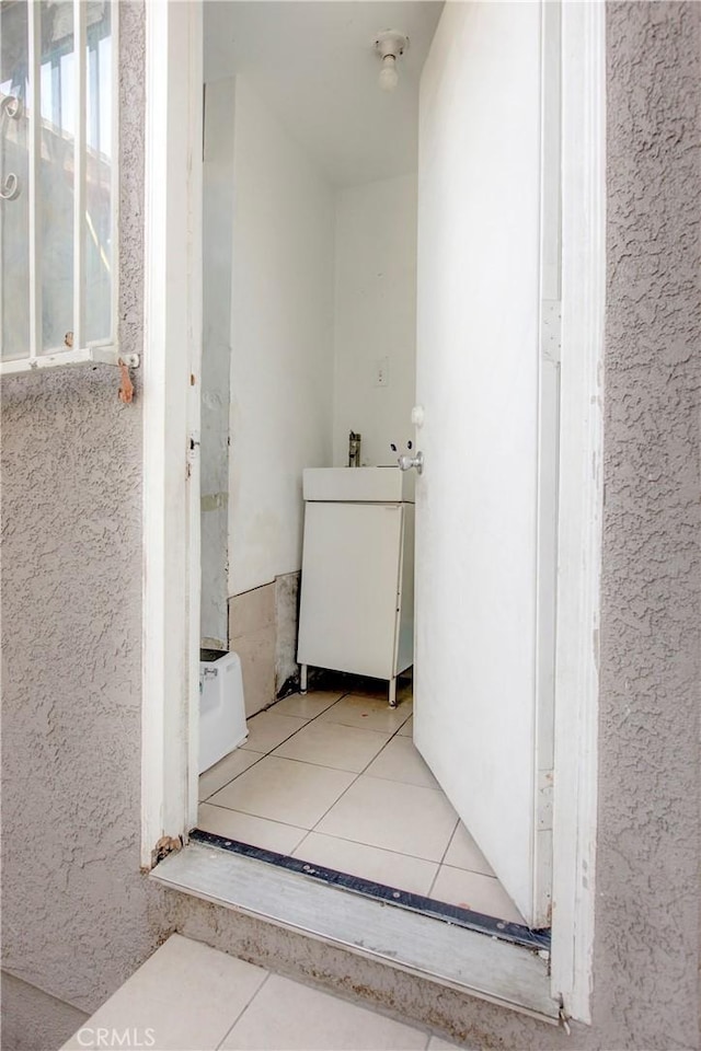 bathroom with tile patterned floors and sink