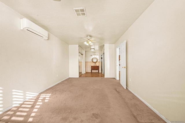 interior space with a wall mounted air conditioner and carpet