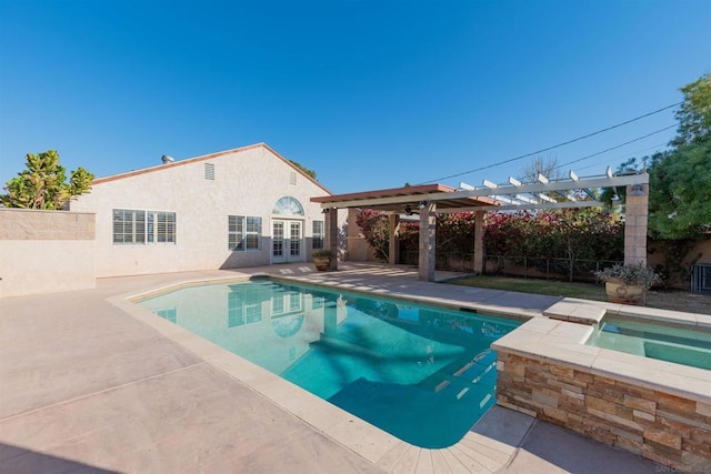 view of swimming pool with an in ground hot tub, a pergola, and a patio