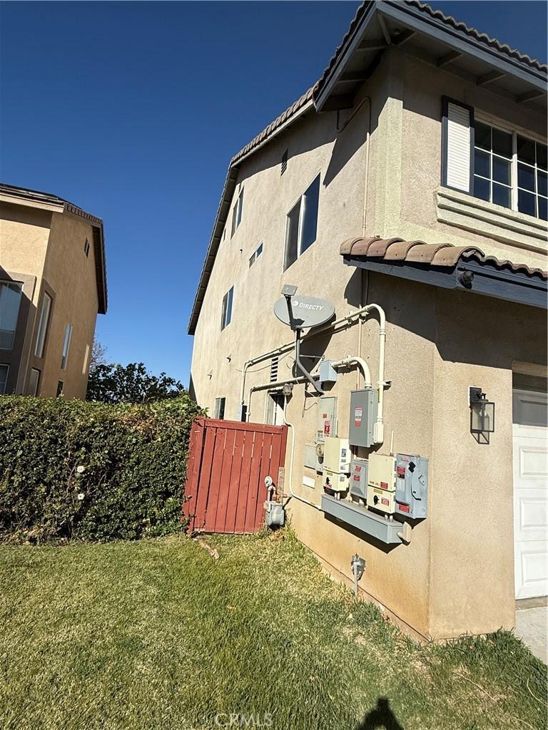 view of property exterior featuring a yard