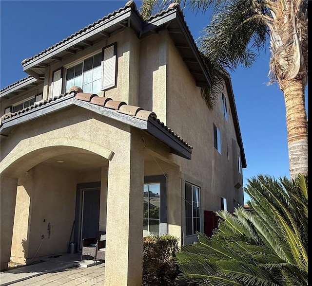 back of property with a patio area