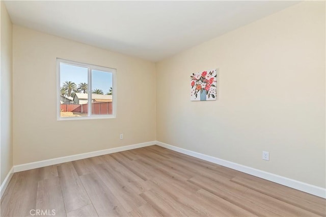 spare room with light wood-type flooring