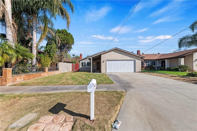 ranch-style home with a garage and a front lawn